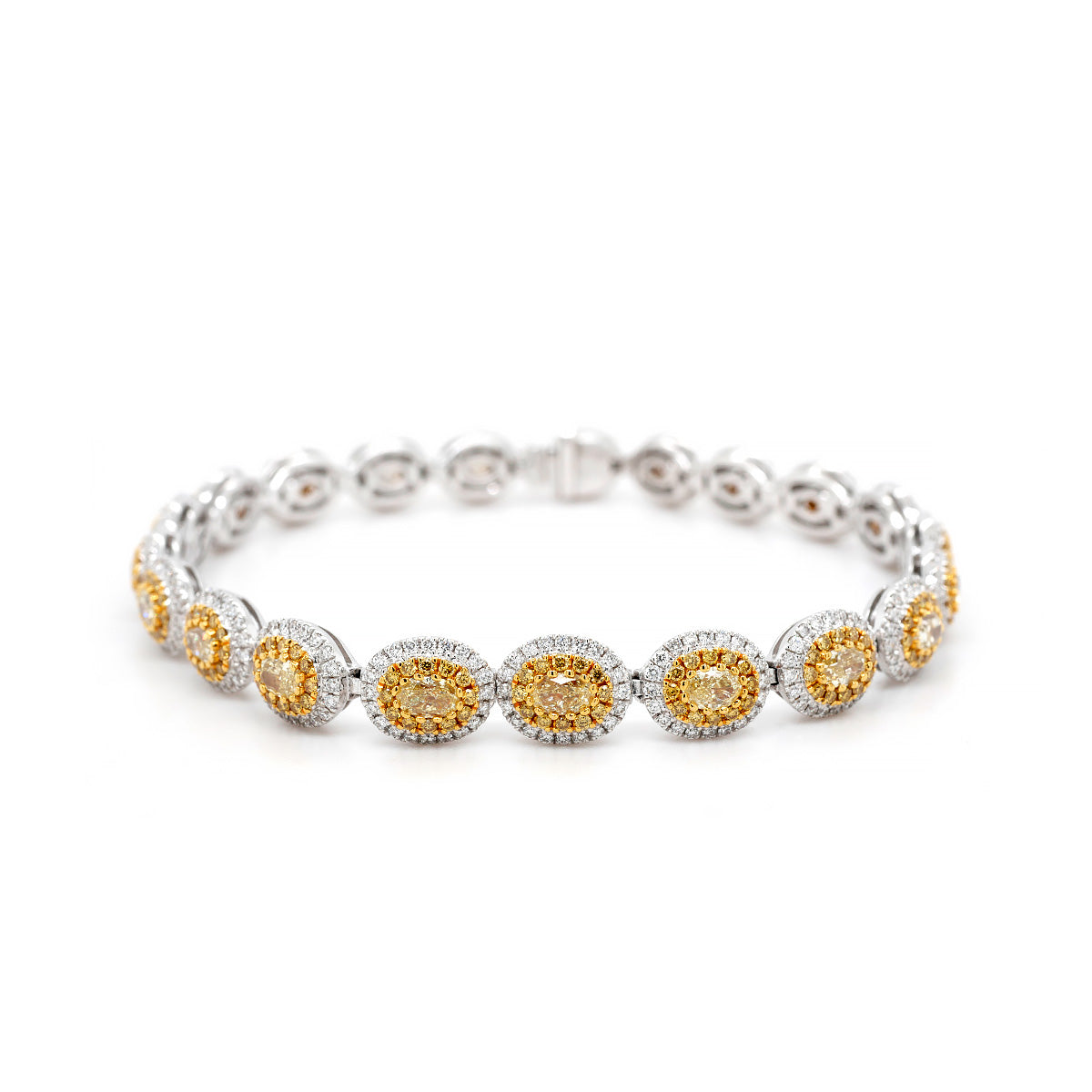 18ct White Gold Bracelet with 3.42ct Yellow Central Oval Diamond and 1.24ct White Diamond Halo