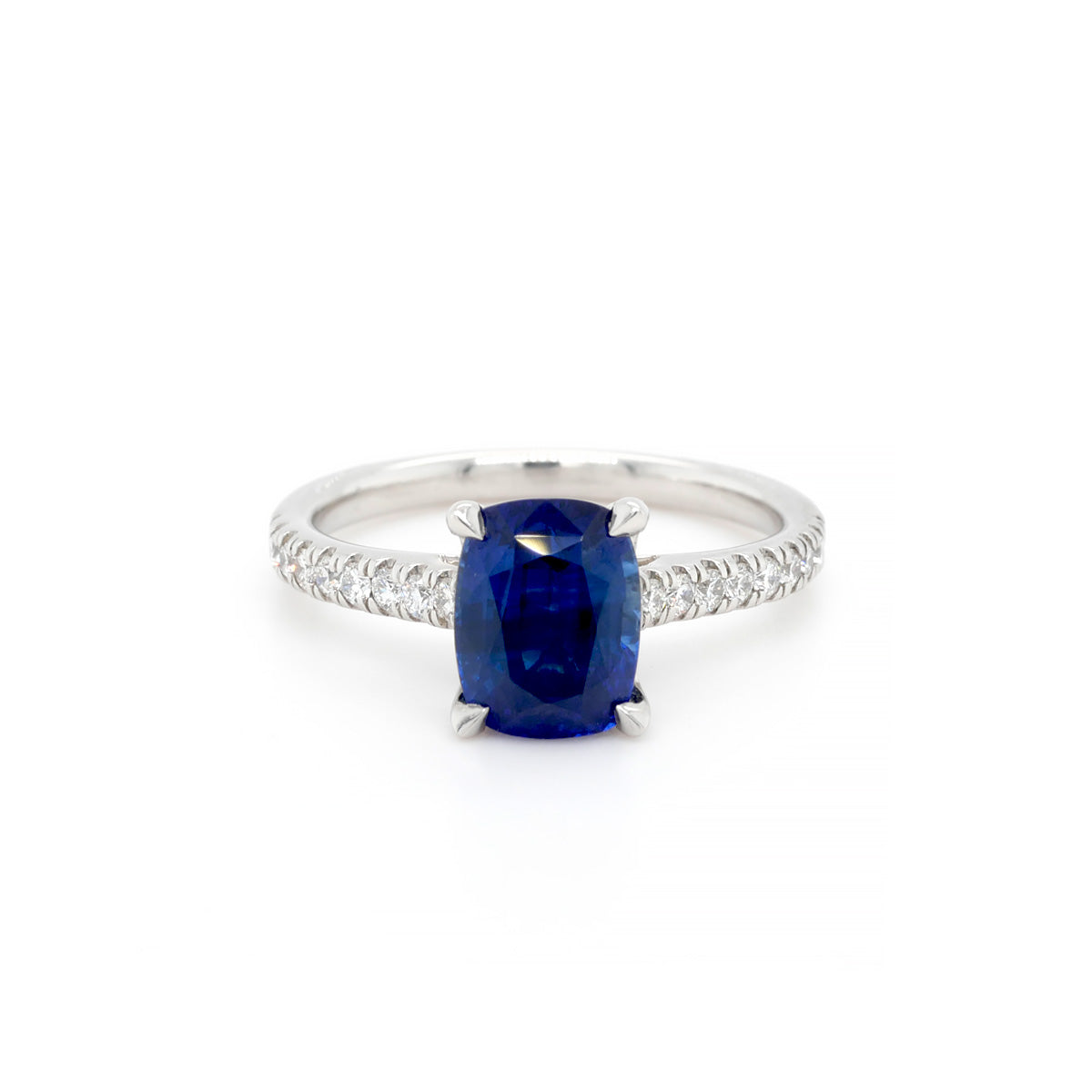 Platinum Single Stone Cushion Cut Sapphire Ring with Round Diamond Set Shoulders